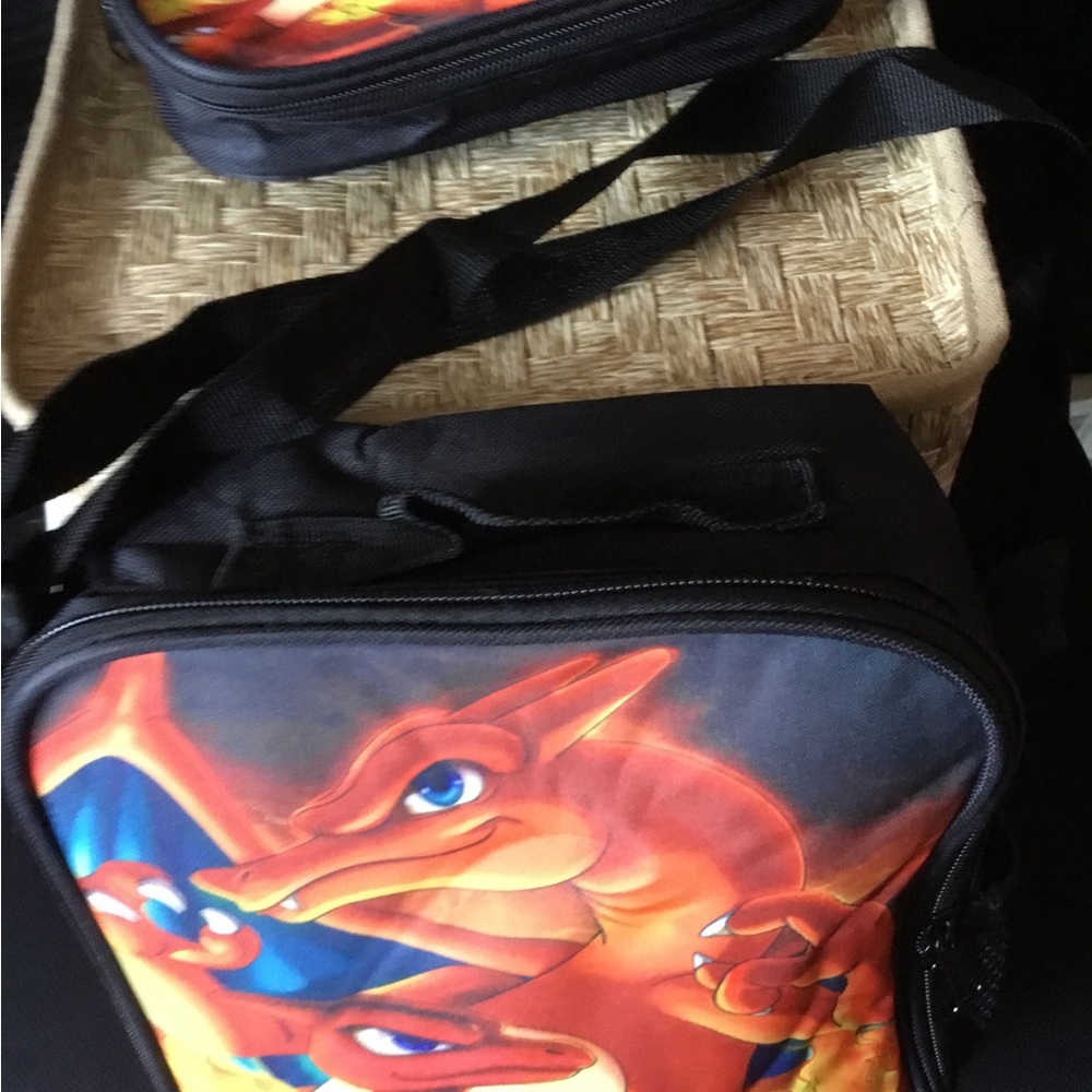 Black and orange Pokémon lunchbox and pencil case